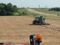 Combine harvesting a field